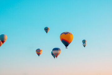 Hot air balloons on the sky in the morning. Magical view with hot air balloons.