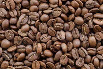 Close up roasted arabica coffee beans background top view...