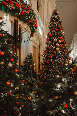 Festive sparkling garlands and shiny decorations on Christmas tree as symbol of Happy New Year and Merry Christmas winter holiday celebration. Vertical