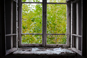 open window with old wooden frame. old window. finely broken glass. old house, retro. cracked window frame. cracked old paint, pieces of glass. space for text. large pieces of glass. close-up © Oleksandr Filatov