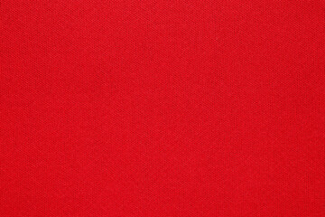 Red fabric texture background close up