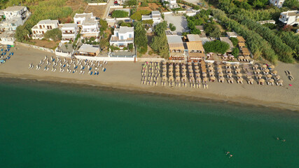 Aerial drone photo of main organised with sun beds and umbrellas sandy beach of Magazia with crystal clear Aegean sea, Skiros island, Sporades, Greece 