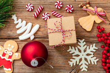 Christmas decoration and preparation flat lay on wooden table background, top view.