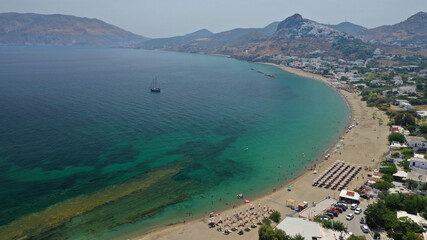 Aerial drone photo of main organised with sun beds and umbrellas sandy beach of Magazia with crystal clear Aegean sea, Skiros island, Sporades, Greece 