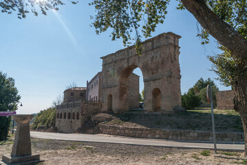 rock tongue next to the sea and vegetation