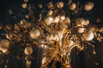 Christmas golden decorations in a festive atmosphere. Christmas and New Year magic holiday concept