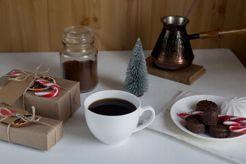 Coffee, Christmas gifts, sweets on a light background