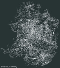 Detailed negative navigation urban street roads map on dark gray background of the German regional capital city of Bielefeld, Germany