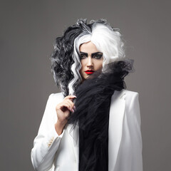 charismatic unusual woman in a black and white outfit with black and white hair,