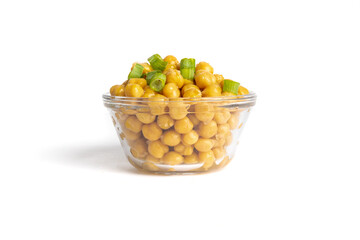 A  glass dish of canned chick peas garnished with green onion slices isolated on white