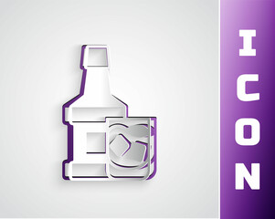 Paper cut Whiskey bottle and glass icon isolated on grey background. Paper art style. Vector