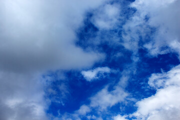 Blue sky background with gray clouds around. autumn day