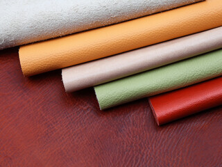 Natural leather textures samples on brown leather background