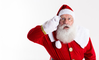 Santa Claus in eyeglasses is looking surprised at camera on white background