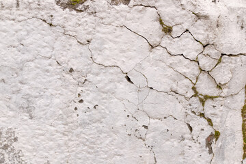Cracked concrete wall covered with white paint  surface as background images