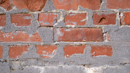 Fototapeta premium Old brick wall with peeling plaster, Brickwall Backdrop.