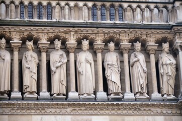 Paris, France - famous Notre Dame cathedral facade saint statues. UNESCO World Heritage Site