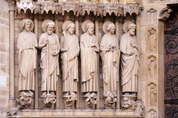 Paris, France - famous Notre Dame cathedral facade saint statues. UNESCO World Heritage Site