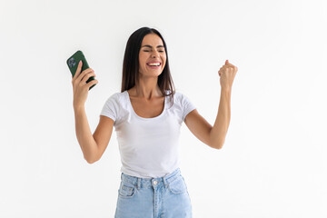 Obraz premium Excited cheerful glad positive satisfied lady raising fist up isolated grey background