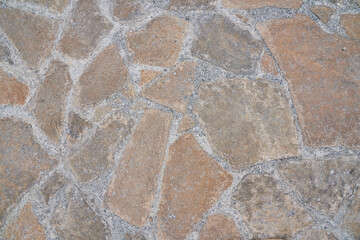 Orange old stone road surface. Seamless Texture. The texture of a stone road. High quality photo