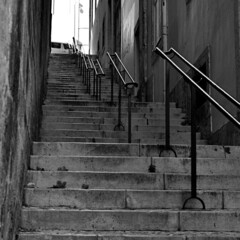 City landscape. Staircase with handrails on narrow street in old town