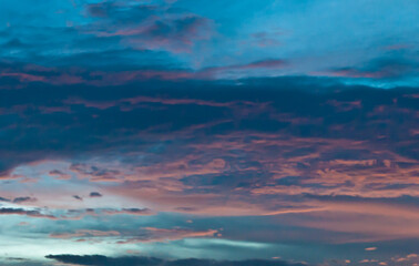 front view, far distance, of a sunset over a tropical location 