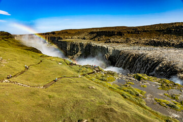 beautiful rainbow formation in Dettifoss waterfall in Iceland