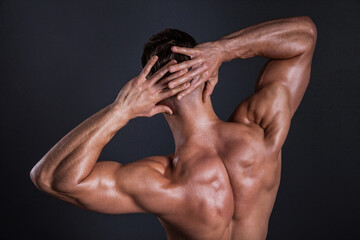 Fototapeta na wymiar Muscular shoulder and back area of a man. Shot in studio.