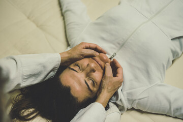 Therapist man doing a Shiatsu massage to a woman. Holistic therapy,  treatment with manipulation by...