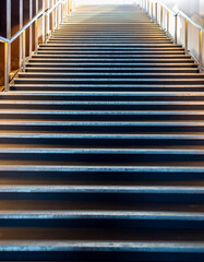 Illuminated stairs coming from underground pedestrian passage leading into the light, Copenhagen, Denmark