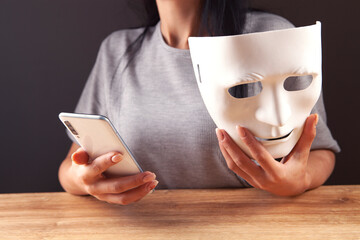  girl with holding a white theatrical mask - obrazy, fototapety, plakaty