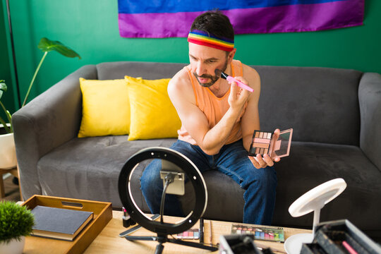 Queer beauty influencer filming a video