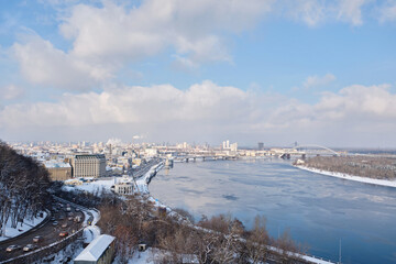 View of the Dnieper River from a glass bridge on a sunny winter day, Kiev