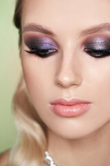 Fototapeta premium Closeup shot of woman eye with evening makeup. Long eyelashes. Smokey Eyes. Studio shot.