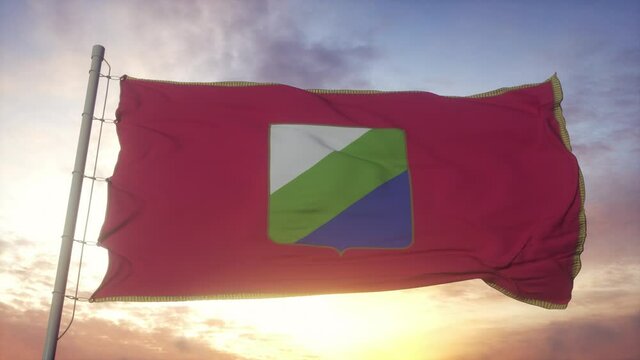Abruzzo flag, Italy, waving in the wind, sky and sun background
