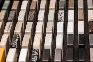 Samples of decorative artificial stone, close-up. Stone samples for kitchen countertops or...