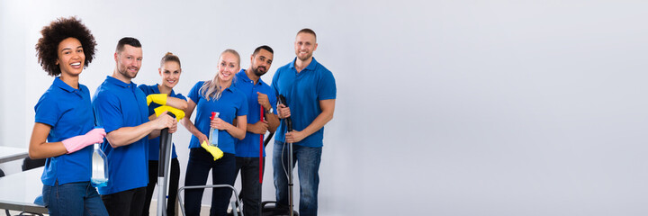 Portrait Of Happy Male And Female Janitors