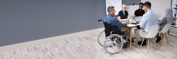 Disabled Businessman In Conference Room