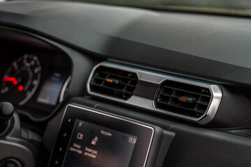 Fototapeta na wymiar Car air conditioning system. Car air condition. Modern car interior detail.