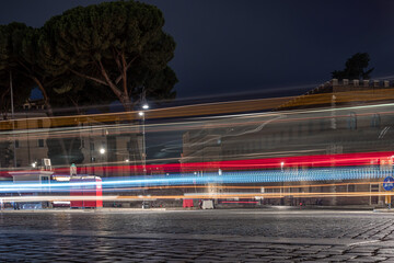 Fototapeta na wymiar traffic in the city at night Piazza Venezia Rome Italy