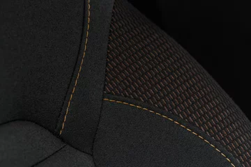 Fotobehang High angle view of modern car fabric seats. Close-up car seat texture and interior details. Detailed image of a car pleats stitch work. © Roman