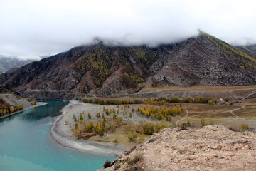 Altai mountain landscape in autumn. The confluence of the Chuya and Katun rivers.