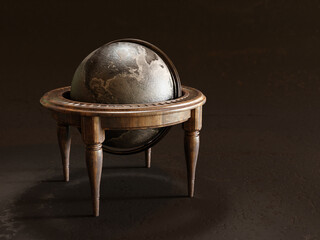 Vintage metal globe on wooden table