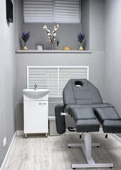Beauty salon interior, modern room with armchair in spa or wellness center.