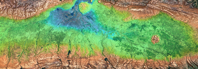Nature pattern on satellite photo. Aerial panoramic view of green fields at river delta. Elements of this image furnished by NASA.