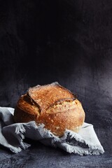 Homemade sourdough bread on the dark background