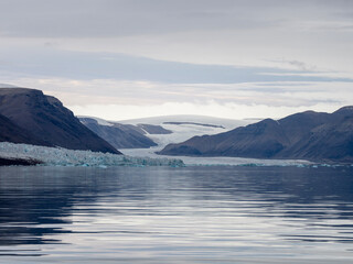 photo of mountain, glacier, sea ice, ocean and icebergs in the canadian arctic © Patrick