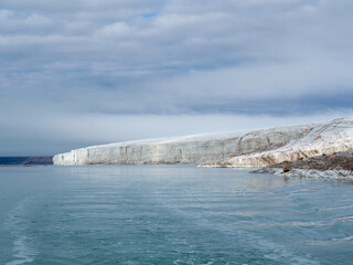 photo of mountain, glacier, sea ice, ocean and icebergs in the canadian arctic