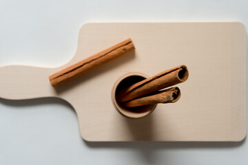 cinnamon sticks arranged on a wooden background