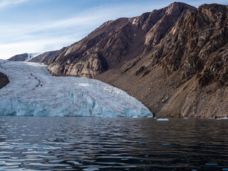 photo of mountain, glacier, sea ice, ocean and icebergs in the canadian arctic © Patrick